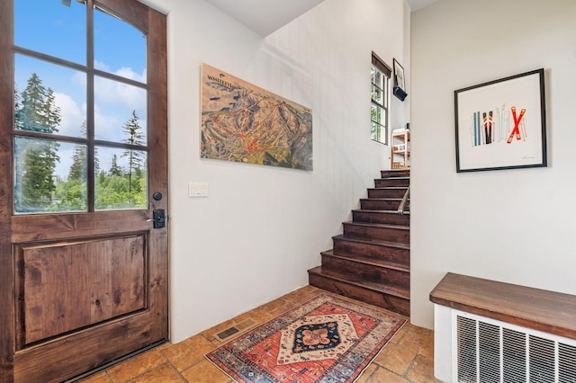 153 Slopeside Dr Unit 14, Whitefish, MT 59937 - entrance foyer with stone tile flooring and stairway