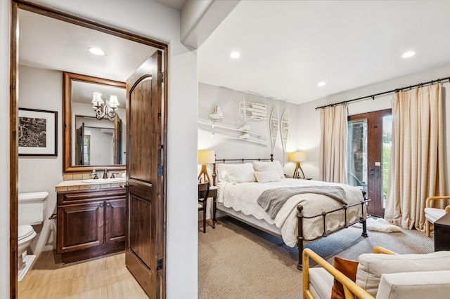 153 Slopeside Dr Unit 14, Whitefish, MT 59937 - bedroom featuring access to outside, recessed lighting, and a chandelier