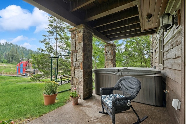 153 Slopeside Dr Unit 14, Whitefish, MT 59937 - view of patio / terrace featuring a hot tub