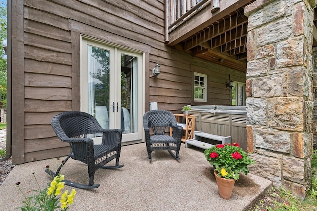 153 Slopeside Dr Unit 14, Whitefish, MT 59937 - view of patio with french doors and a hot tub