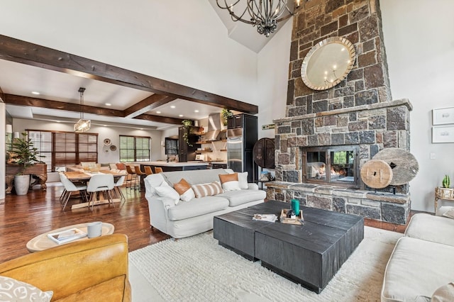 153 Slopeside Dr Unit 14, Whitefish, MT 59937 - living room featuring wood finished floors, a fireplace, and beam ceiling