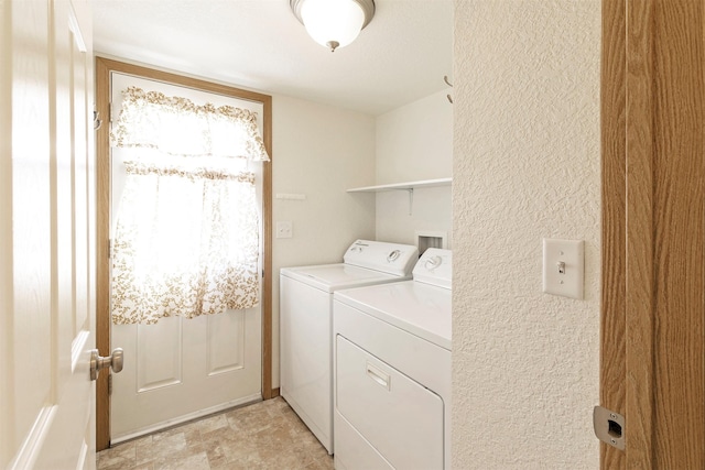 4431 Chesapeake Way, Missoula, MT 59808 - laundry room with washing machine and dryer, light stone finish flooring, and a textured wall