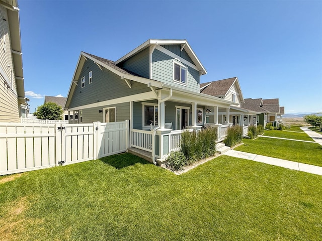 2876 Twilight Ave, Helena, MT 59601 - view of property exterior with covered porch, board and batten siding, a gate, and roof with shingles