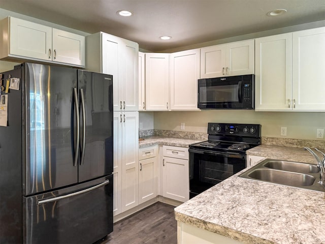 2876 Twilight Ave, Helena, MT 59601 - kitchen with black appliances, dark wood-style flooring, light countertops, recessed lighting, and white cabinets
