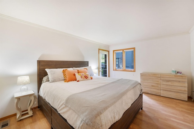 183B Eagle Bend Dr, Bigfork, MT 59911 - bedroom with crown molding and light wood-style flooring