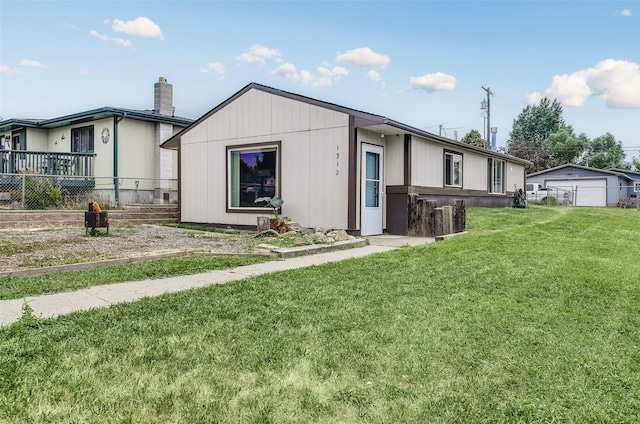 1312 2nd Ave NW, Great Falls, MT 59404 - view of front facade featuring a garage and a chimney