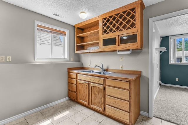 1312 2nd Ave NW, Great Falls, MT 59404 - bar with a textured ceiling and light tile patterned flooring