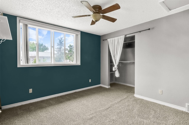 1312 2nd Ave NW, Great Falls, MT 59404 - unfurnished bedroom with a textured ceiling, carpet, a closet, and ceiling fan