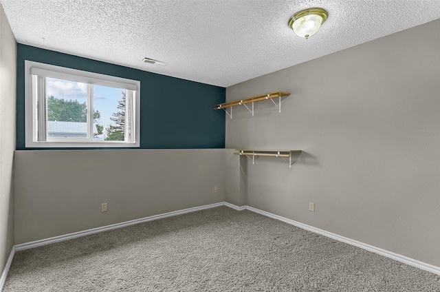 1312 2nd Ave NW, Great Falls, MT 59404 - carpeted empty room featuring a textured ceiling and baseboards