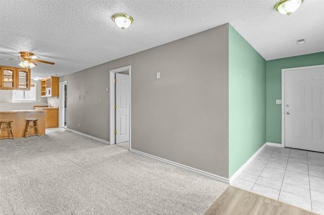 1312 2nd Ave NW, Great Falls, MT 59404 - unfurnished living room featuring a textured ceiling and a ceiling fan