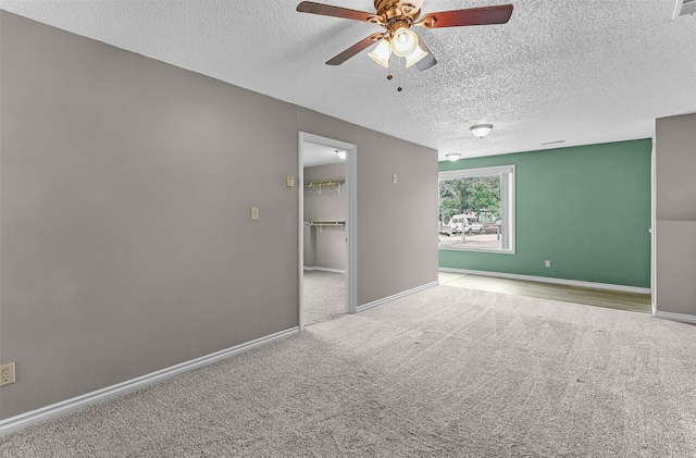1312 2nd Ave NW, Great Falls, MT 59404 - spare room with a ceiling fan, carpet, and a textured ceiling