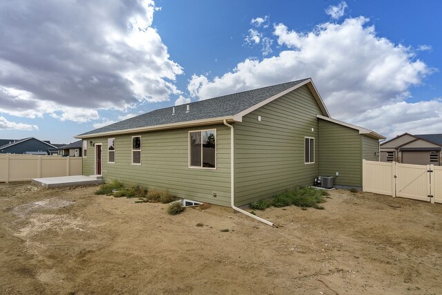 243 Stirling Loop, East Helena, MT 59635 - back of house with a gate and roof with shingles