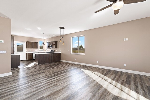 243 Stirling Loop, East Helena, MT 59635 - unfurnished living room featuring a ceiling fan and dark wood finished floors