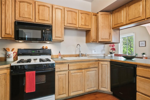 915 3rd St, Missoula, MT 59802 - kitchen featuring black appliances, light countertops, and wood finished floors