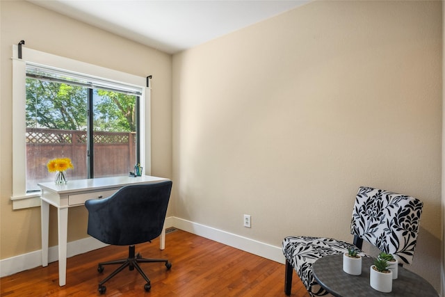 915 3rd St, Missoula, MT 59802 - office area featuring baseboards and wood finished floors