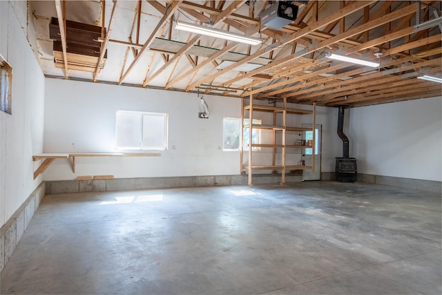 915 3rd St, Missoula, MT 59802 - garage with a wood stove and a garage door opener