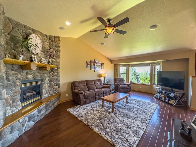 3640 Jack Dr, Missoula, MT 59803 - living area with a ceiling fan, vaulted ceiling, a textured ceiling, a fireplace, and wood finished floors