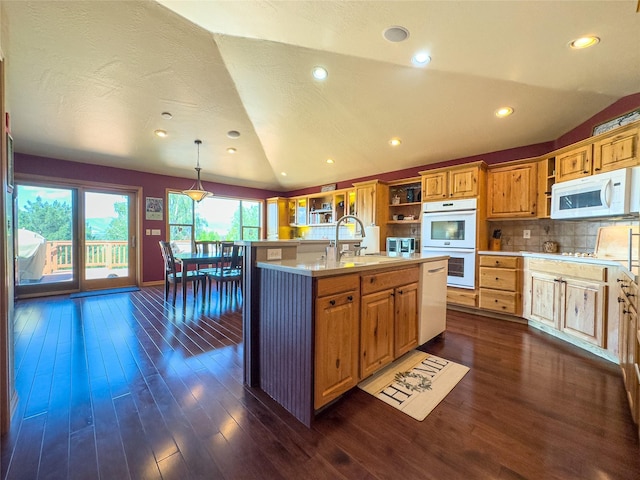 3640 Jack Dr, Missoula, MT 59803 - kitchen with white appliances, light countertops, open shelves, vaulted ceiling, and dark wood-style floors