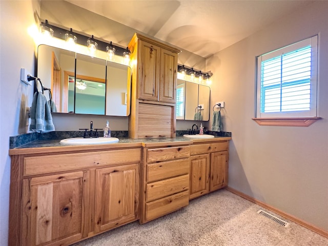3640 Jack Dr, Missoula, MT 59803 - full bath with double vanity, carpet flooring, and a ceiling fan