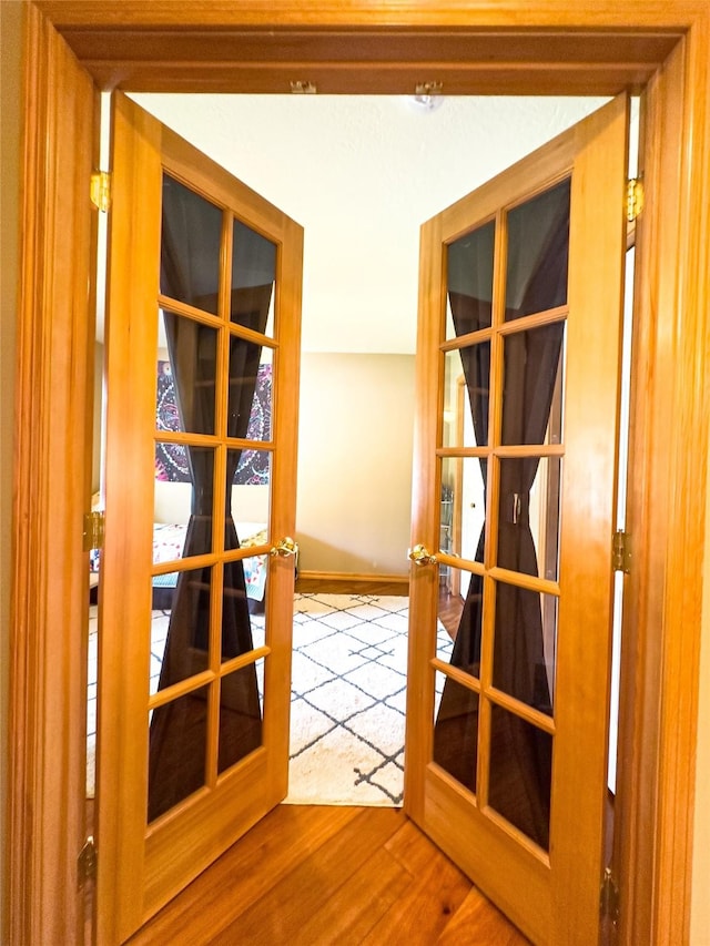 3640 Jack Dr, Missoula, MT 59803 - corridor with french doors and wood finished floors