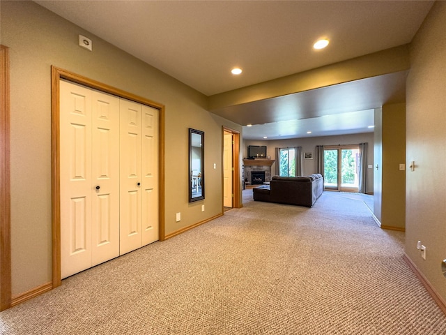 3640 Jack Dr, Missoula, MT 59803 - unfurnished living room with light colored carpet, a fireplace, and recessed lighting