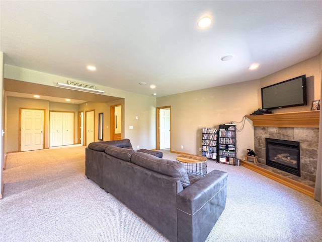 3640 Jack Dr, Missoula, MT 59803 - carpeted living room featuring a tiled fireplace and recessed lighting