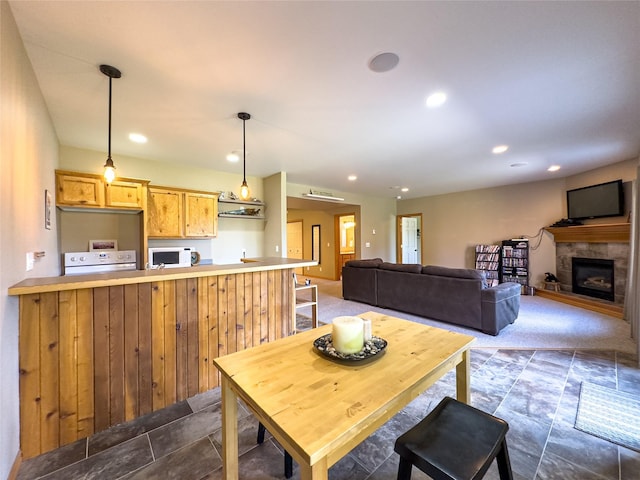 3640 Jack Dr, Missoula, MT 59803 - dining space with recessed lighting, dark stone finish flooring, and a tile fireplace