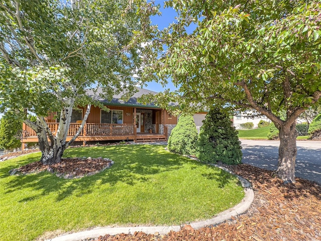 3640 Jack Dr, Missoula, MT 59803 - view of front of property with a front yard, covered porch, and a shingled roof