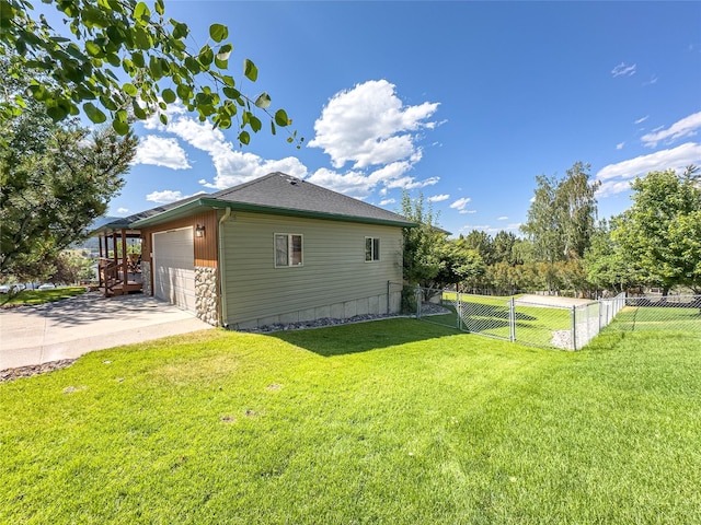 3640 Jack Dr, Missoula, MT 59803 - view of side of home with concrete driveway, stone siding, and a garage