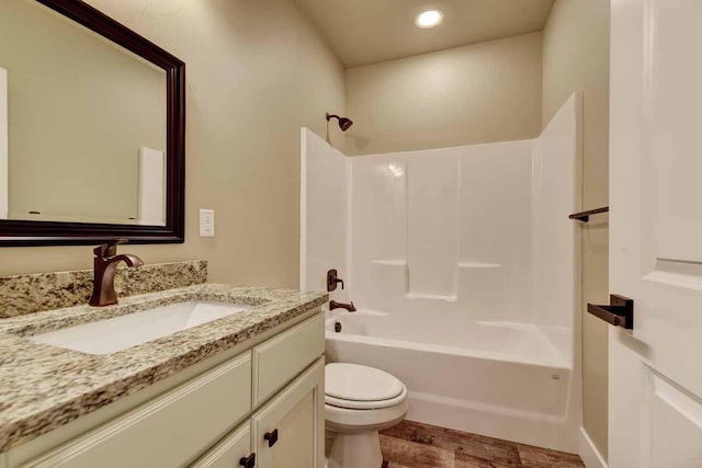 2909 Travis Ave, Helena, MT 59601 - full bath featuring vanity, bathing tub / shower combination, recessed lighting, and wood finished floors