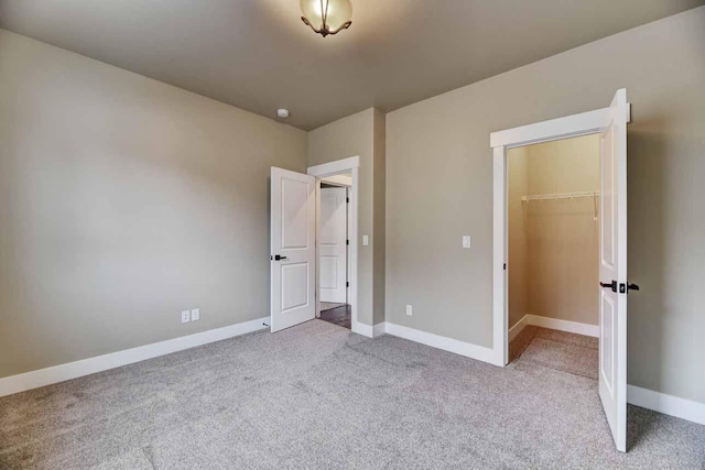 2909 Travis Ave, Helena, MT 59601 - unfurnished bedroom featuring carpet flooring, a spacious closet, and a closet