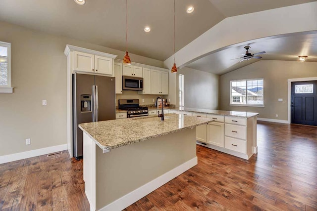 2909 Travis Ave, Helena, MT 59601 - kitchen featuring stainless steel appliances, vaulted ceiling, white cabinetry, ceiling fan, and a peninsula