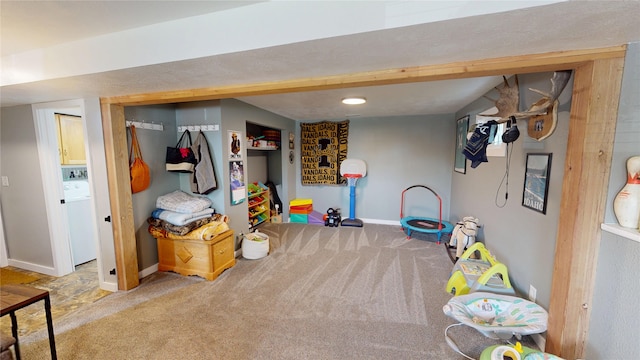 181 Ridgeway Dr, Lolo, MT 59847 - recreation room featuring carpet and washer / dryer