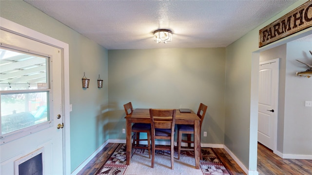 181 Ridgeway Dr, Lolo, MT 59847 - dining room featuring wood finished floors and a textured ceiling