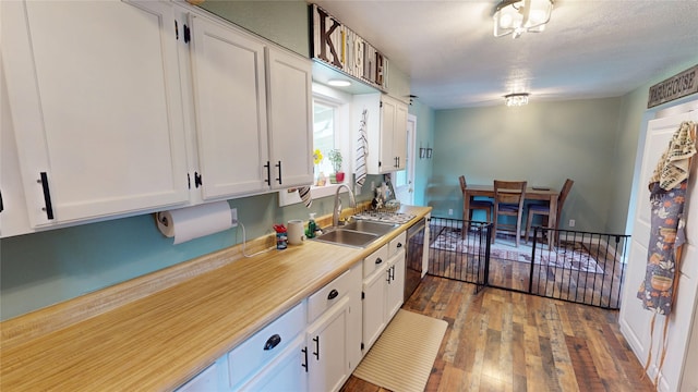181 Ridgeway Dr, Lolo, MT 59847 - kitchen with white cabinets, hardwood / wood-style flooring, light countertops, and stainless steel dishwasher
