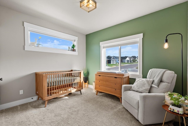 7070 Max Dr, Missoula, MT 59803 - carpeted bedroom with a nursery area and baseboards