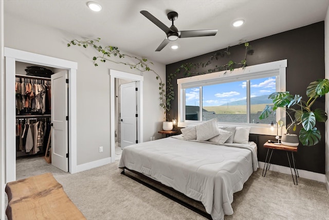 7070 Max Dr, Missoula, MT 59803 - bedroom with a spacious closet, light colored carpet, recessed lighting, ensuite bathroom, and a closet