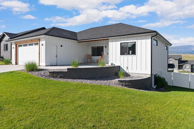 7070 Max Dr, Missoula, MT 59803 - view of front facade with board and batten siding, an attached garage, driveway, and roof with shingles