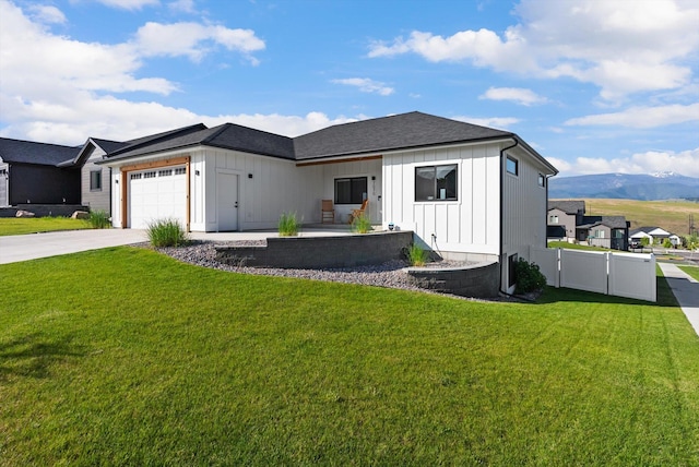 7070 Max Dr, Missoula, MT 59803 - view of front of home featuring board and batten siding, an attached garage, and concrete driveway