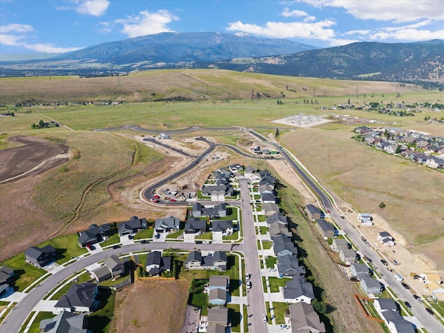 7070 Max Dr, Missoula, MT 59803 - aerial view of property's location with a mountain backdrop, rural landscape, and nearby suburban area
