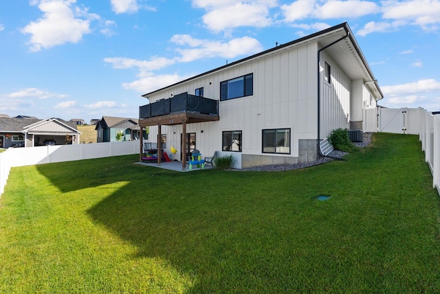 7070 Max Dr, Missoula, MT 59803 - rear view of house with a gate, a fenced backyard, a patio area, and board and batten siding