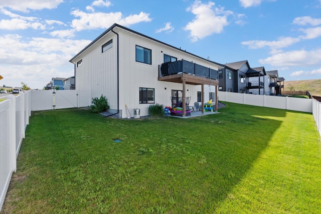 7070 Max Dr, Missoula, MT 59803 - rear view of property with a balcony, a gate, a fenced backyard, and a patio