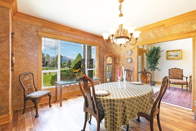 424 Saddle Ridge Rd, Hamilton, MT 59840 - dining space featuring a chandelier, light wood-style floors, crown molding, and a mountain view
