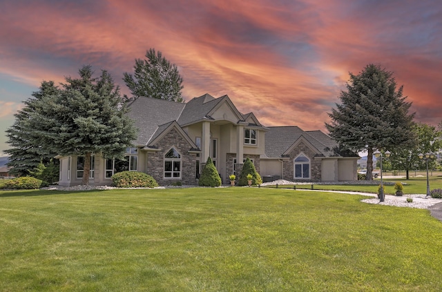 424 Saddle Ridge Rd, Hamilton, MT 59840 - view of front of house with stone siding, stucco siding, and a yard