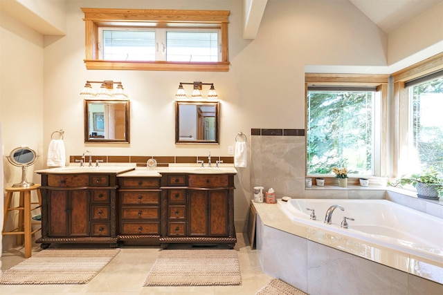 424 Saddle Ridge Rd, Hamilton, MT 59840 - bathroom with double vanity, a bath, tile patterned flooring, and vaulted ceiling