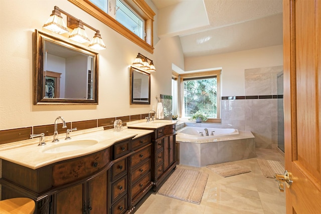 424 Saddle Ridge Rd, Hamilton, MT 59840 - full bath with a bath, double vanity, tiled shower, and tile patterned flooring