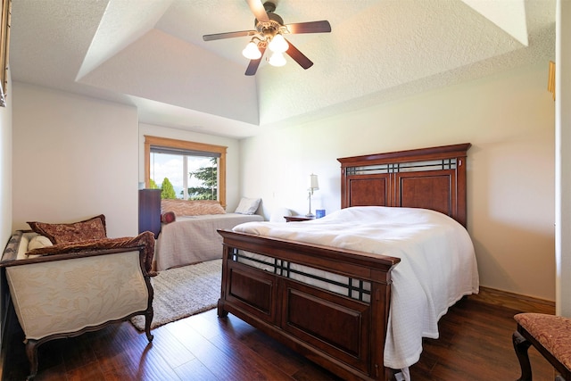 424 Saddle Ridge Rd, Hamilton, MT 59840 - bedroom with dark wood-style floors, lofted ceiling, and a ceiling fan