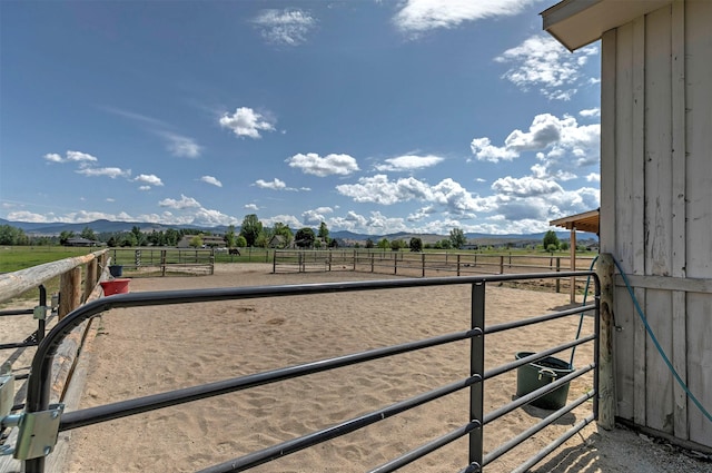 424 Saddle Ridge Rd, Hamilton, MT 59840 - view of yard featuring a view of rural / pastoral area, an exterior structure, and a mountain view