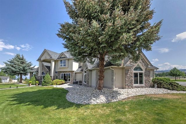 424 Saddle Ridge Rd, Hamilton, MT 59840 - view of front of home featuring stone siding, stucco siding, and a front yard