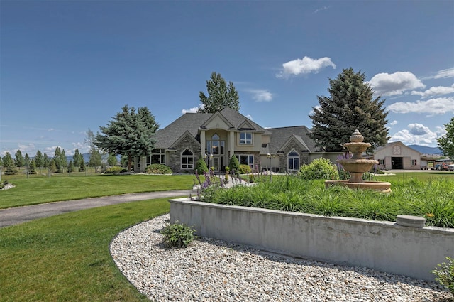 424 Saddle Ridge Rd, Hamilton, MT 59840 - view of front of home with stone siding and a front yard